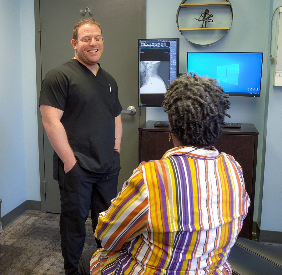 Doctor Ortman Chiropractic With Patient